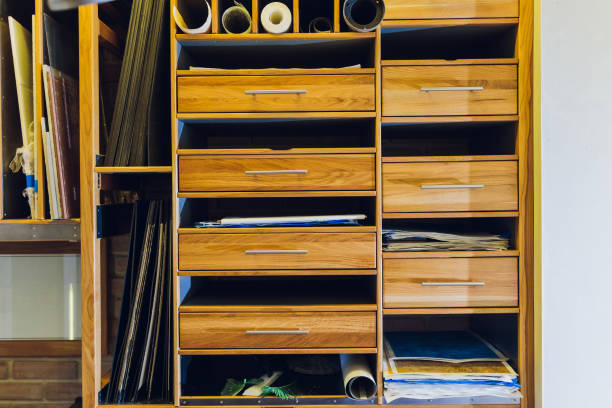istock Interior designer's workplace. Architectural project architectural plan, color swatches at the desk. 1212440591