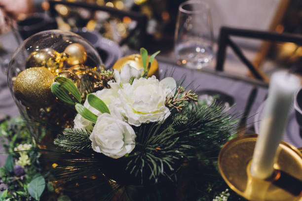istock Gold Christmas background of de-focused lights with decorated tree. 1212440973
