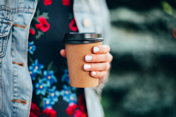 istock Female hand with coffee take away. 1212441057