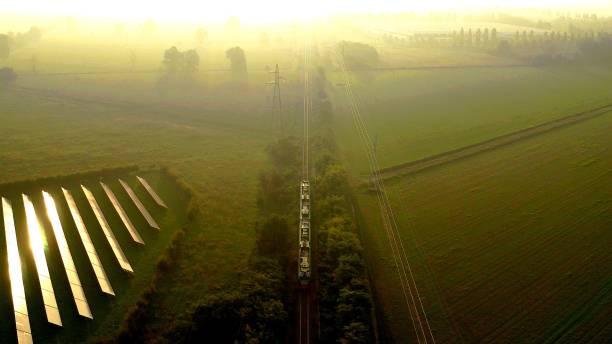 istock Renewable energy with a train and solar panels 1212446315