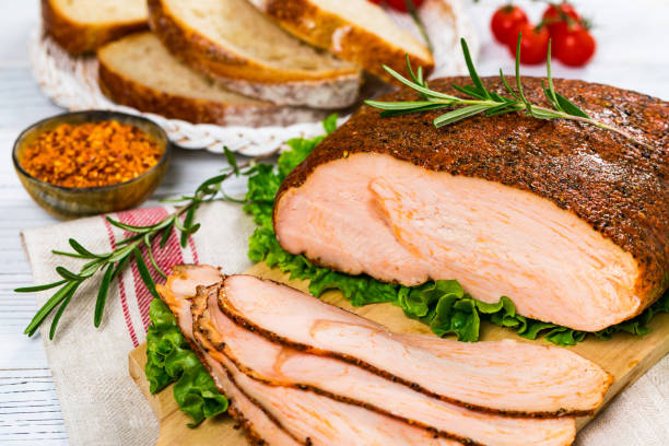 Roasted Turkey Breast Cajun Style Deli Lunch Meat Roasted Turkey Breast Cajun Style Deli Lunch Meat on Old Wooden Background. Selective focus. turkey breast stock pictures, royalty-free photos & images