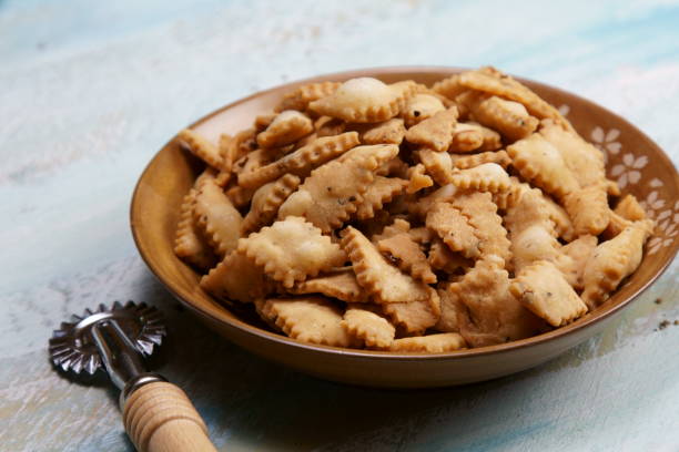 istock Namakpara (Khurma, Nimki, Mathri) which is a crispy, crunchy and savory strips in a bowl. 1212454726