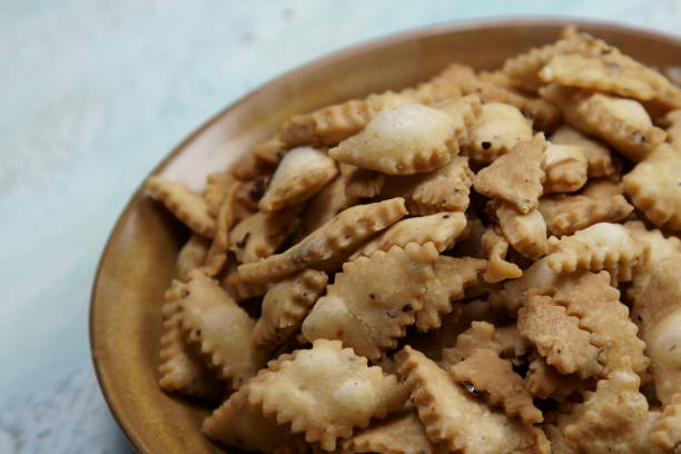 istock Namakpara (Khurma, Nimki, Mathri) which is a crispy, crunchy and savory strips in a bowl. 1212454749