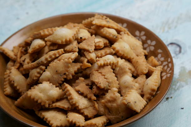 istock Namakpara (Khurma, Nimki, Mathri) which is a crispy, crunchy and savory strips in a bowl. 1212454752