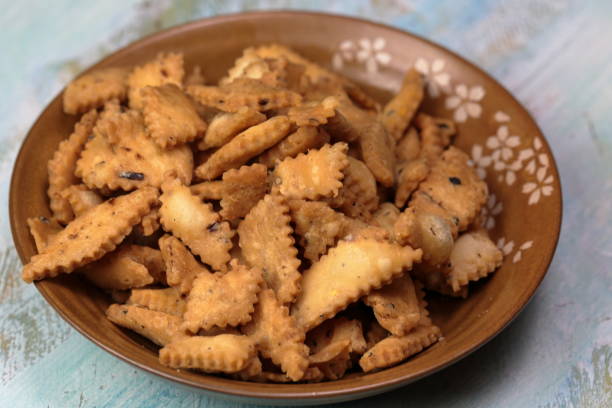istock Namakpara (Khurma, Nimki, Mathri) which is a crispy, crunchy and savory strips in a bowl. 1212455425