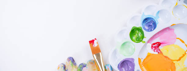 istock Design concept - Preparing for Easter celebration, painting Easter eggs with colorful Acrylic pigment color dyestuff in palette. 1212458685