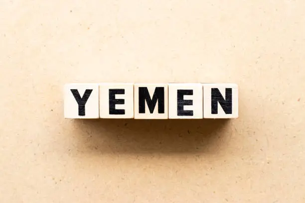 Photo of Letter block in word yemen on wood background