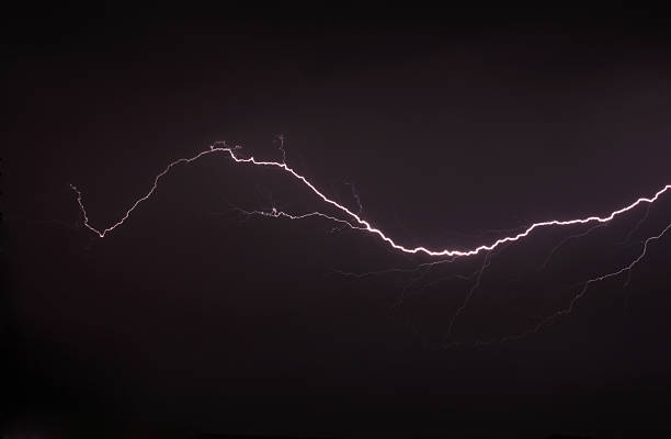 Lightning a thunderstorm, nightly cloudy sky stock photo