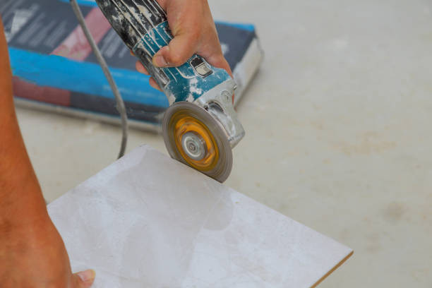 Tiling tile trimming cutting repair of the floor gres tiles contractor using a circular disc