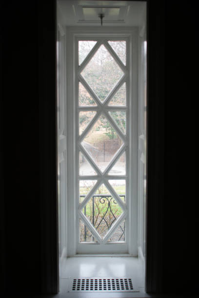 istock A Long Old White Wooden Window Looking Outside 1212466590