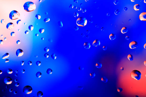 istock Backgrounds Condensation Blue Red Raindrop Water Wet 1212467609