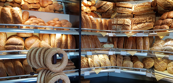 breads and begels on bakery front store in greece