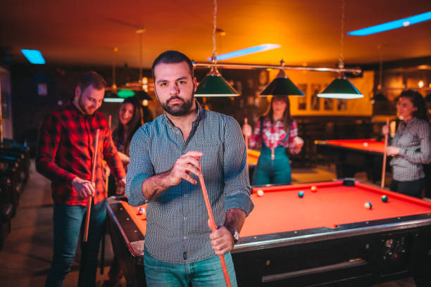 istock A young man at a billiards club 1212467707