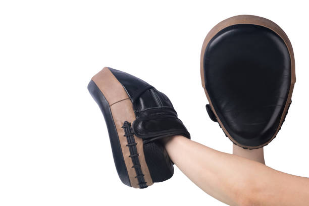 istock on hands wearing boxing paws for training, isolated on a white background 1212468316