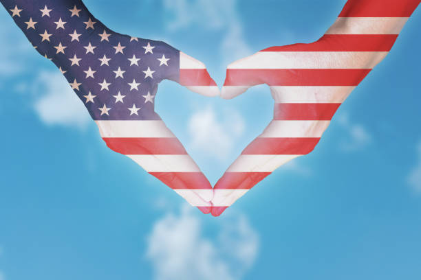 istock Australian flag painted on hands in heart shaped. 1212472240