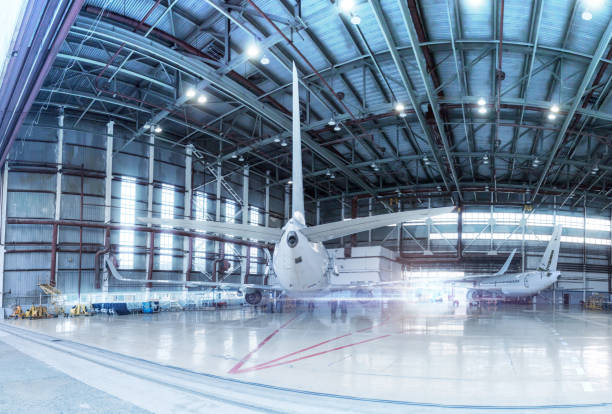 istock Passenger aircrafts under maintenance. Checking mechanical systems for flight operations. Panorama of airplanes in the hangar 1212474641