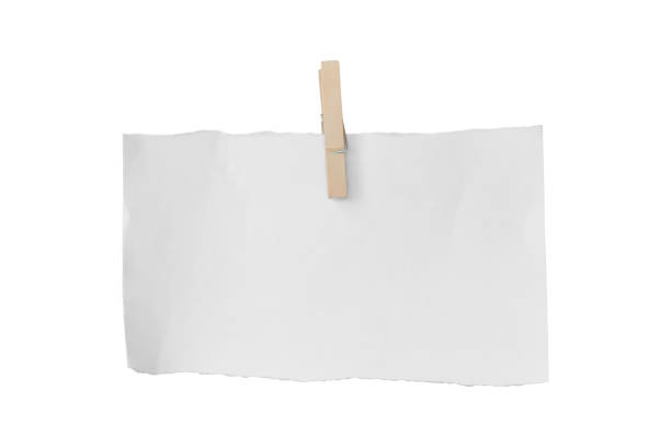 istock Wooden clip and white paper torn isolated on white background. Object with clipping path 1212474804