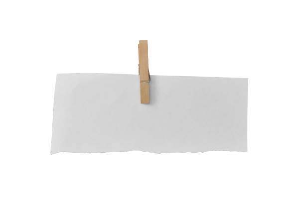 istock Wooden clip and white paper torn isolated on white background. Object with clipping path 1212474856
