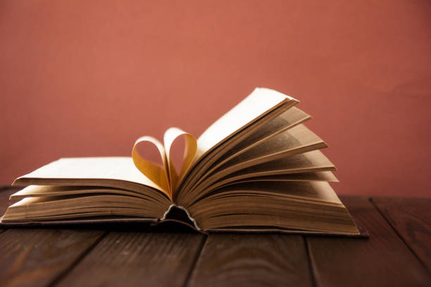 istock Heart book page. Valentines Day heart shaped book pages 1212479182
