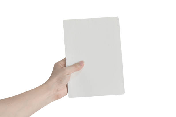 istock Hands holding empty white paper isolated on white background with clipping path. Copy space for text. 1212479190