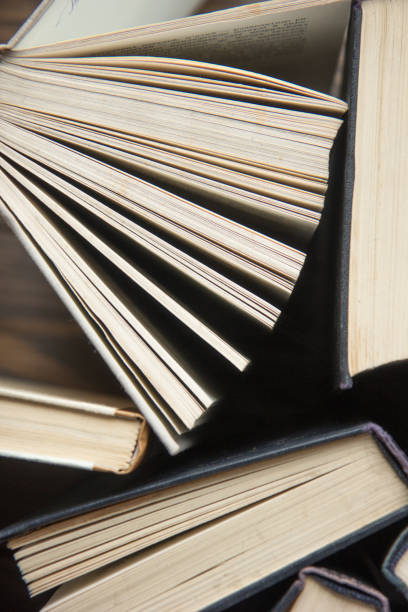 istock Word book day. Stack of colorful books. Education background. Back to school. Book, hardback colorful books on wooden table. Education business concept. Copy space for text 1212479217