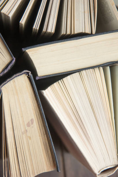 istock Word book day. Stack of colorful books. Education background. Back to school. Book, hardback colorful books on wooden table. Education business concept. Copy space for text 1212479721