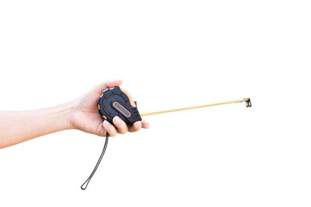 istock Measuring Tape in hand isolated on white background with clipping path 1212479763