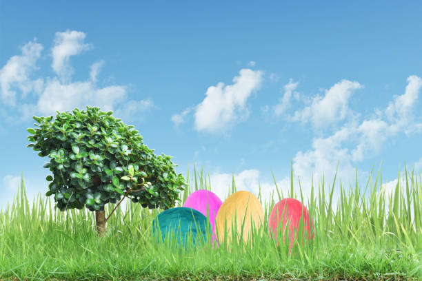 istock Decorated easter eggs in the grass with blue sky background 1212479786