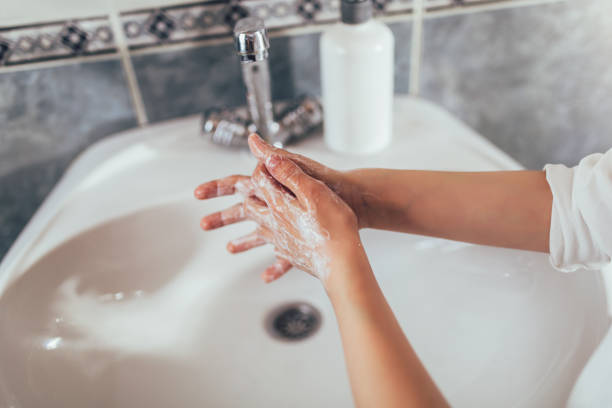istock Little boy washing hands in a bathroom. 1212479820