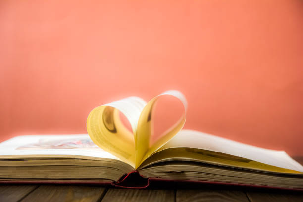 istock Heart book page. Valentines Day heart shaped book pages 1212479828