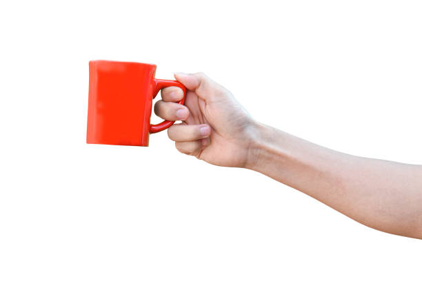 istock hand holding red cup isolated on white background with clipping path. 1212479833