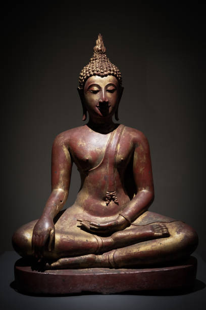 istock Closed up Old gold buddha statue 1212481247