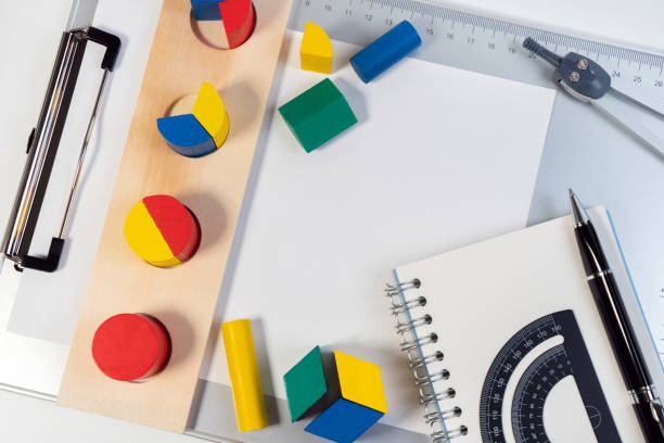 istock Math fractions tools and toys to learn for primary and elementary kids. Mathematics tools for learning basic math. Background presentation. 1212483418