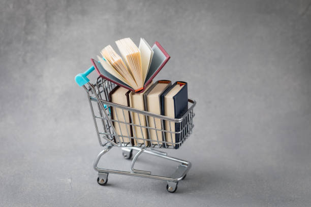 Stack of books in trolley, bookshop concept Books in trolley, bookshop, back to school, college, University, World books Day concept book bookstore sale shopping stock pictures, royalty-free photos & images