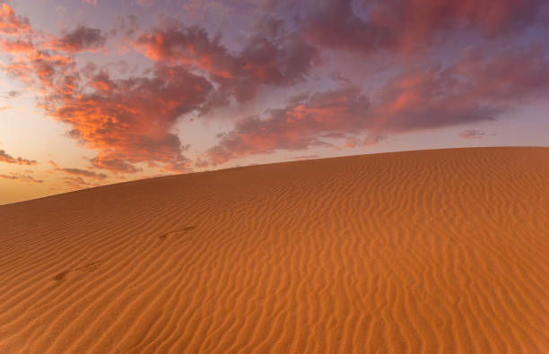 istock wonderful, dramatic sky over the sandy desert after sunset 1212486692