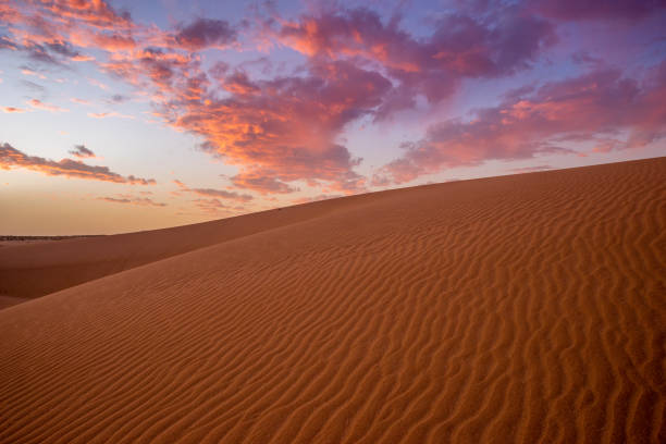 istock wonderful, dramatic sky over the sandy desert after sunset 1212486744