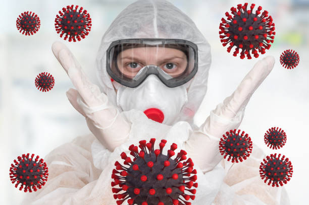 istock Scientist with FFP3 respirator mask is showing STOP gesture 1212486762