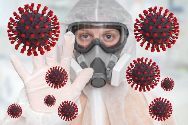 istock Scientist with FFP3 respirator mask is showing STOP gesture 1212486797