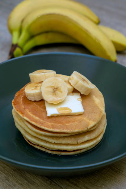 istock Stack of Pancakes with maple syrup and bananas 1212486935