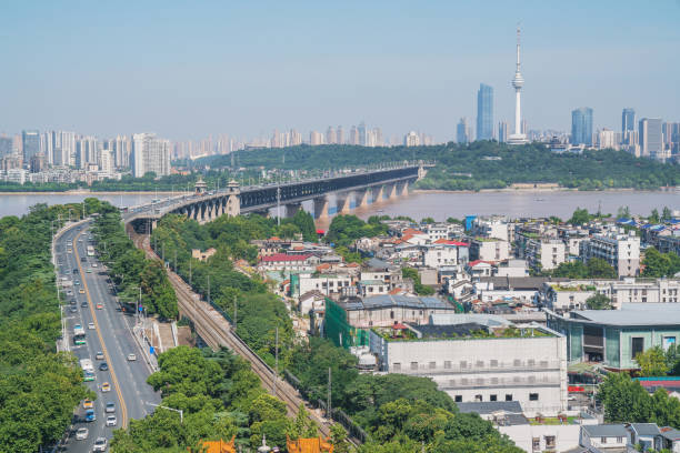 istock Overlooking the Yangtze River Bridge and the urban architecture skyline on both sides of Wuhan City, Hubei Province, China 1212487698