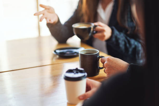 people enjoyed talking and drinking coffee together in cafe
