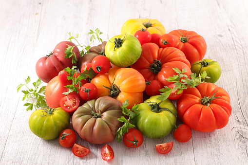 assorted of colorful tomato and herbs