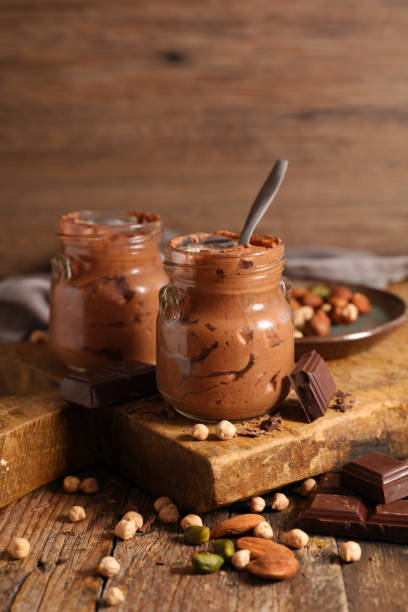 istock delicious vegan chocolate mousse on wooden board 1212490493