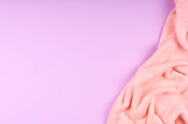 istock Spa concept idea,towel on purple background. 1212494575