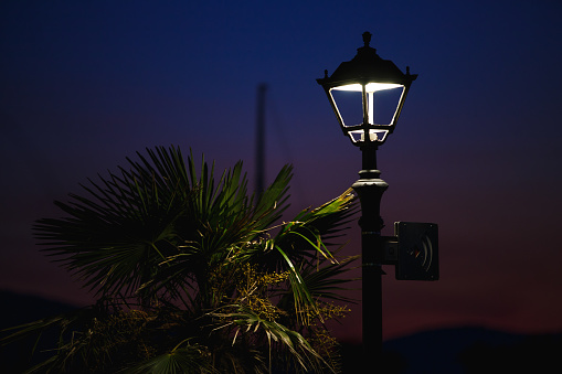 Street light with blurred background. Retro lantern close up at night