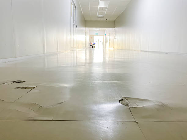 istock cracked floor in factory,dilapidated building,broken corridor 1212497275