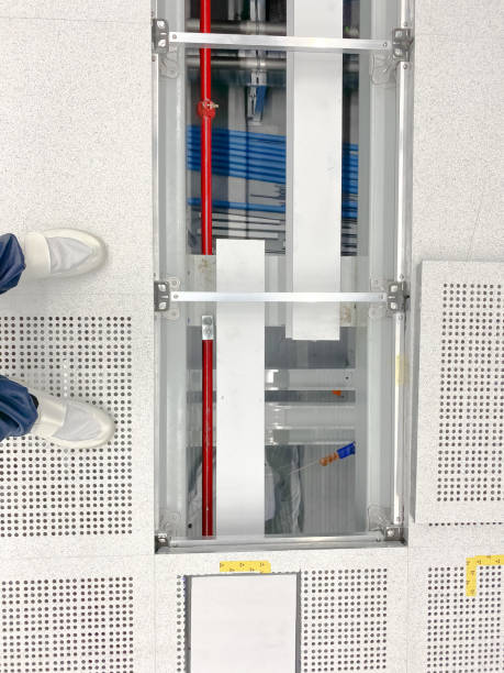 istock vendor working at raised floor at clean room 1212497338