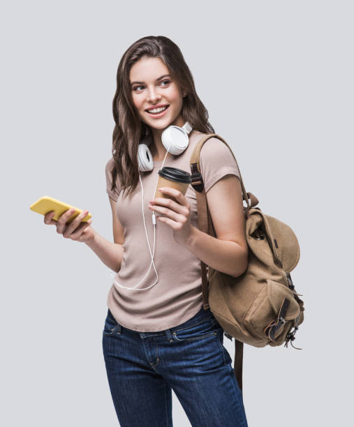 istock Happy student girl using smart phone 1212498494