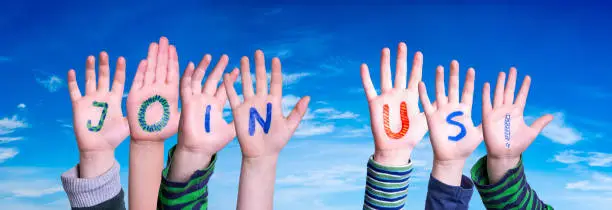 Photo of Children Hands Building Word Join Us, Blue Sky