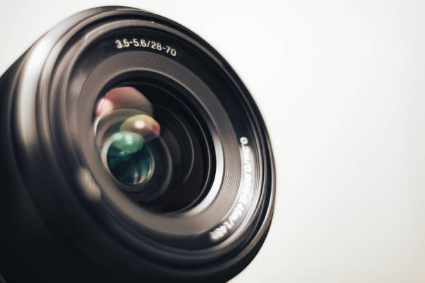 istock Close up beautiful camera lens on a gray background. 1212505332